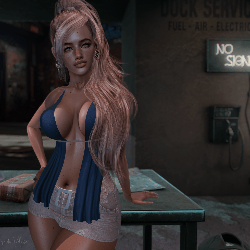 image of a female avatar. her blonde hair in a pony tail. Wearing a teal blue tank top and a light tan denim skirt.